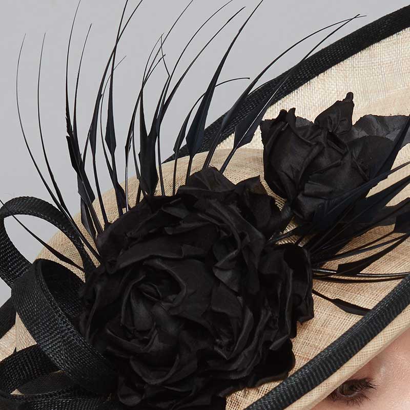 Close up of a natural ridge sidesweep with a black edge, black silk roses and diamond-cut feathers