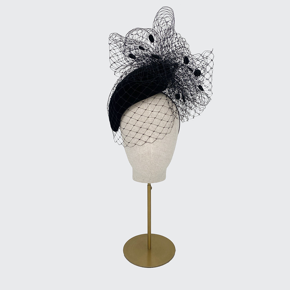 Black teardrop pillbox with spot veiling