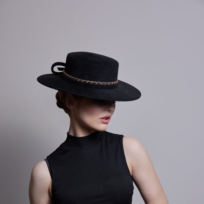 Black velour boater with gold chain and twist