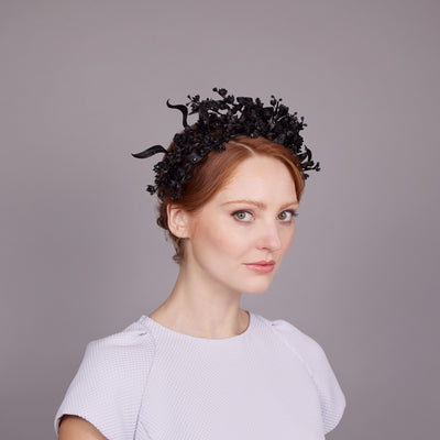 Woman with red hair with a black delicate flower headdress