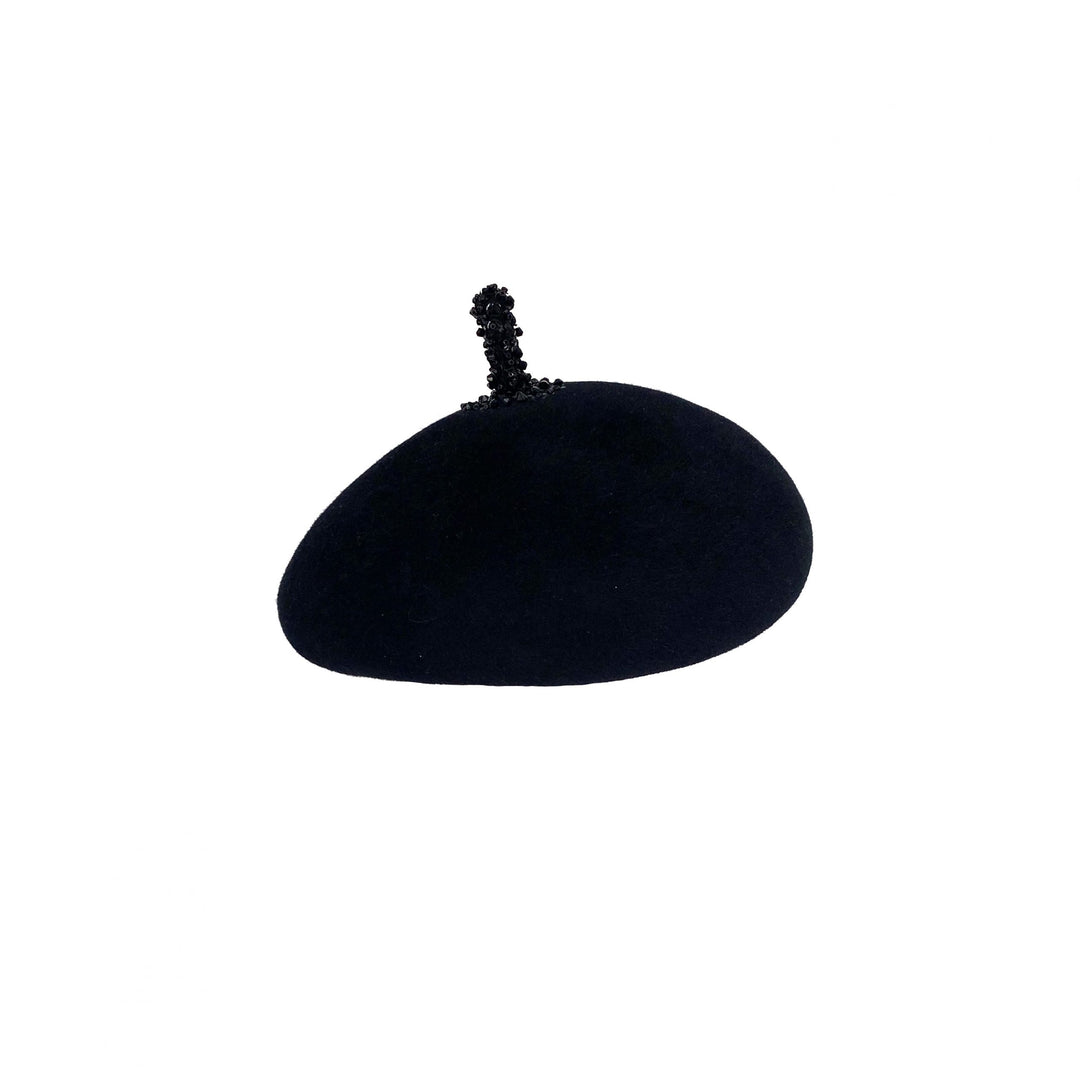 Photo of a black velour felt beret with a beaded stalk
