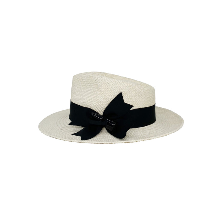 Side view of a white panama trilby with a black grosgrain double bow