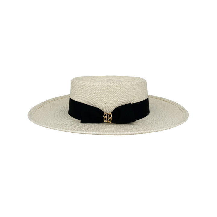 Photo of a white panama plantation fedora with a black grosgrain bow with chain detail