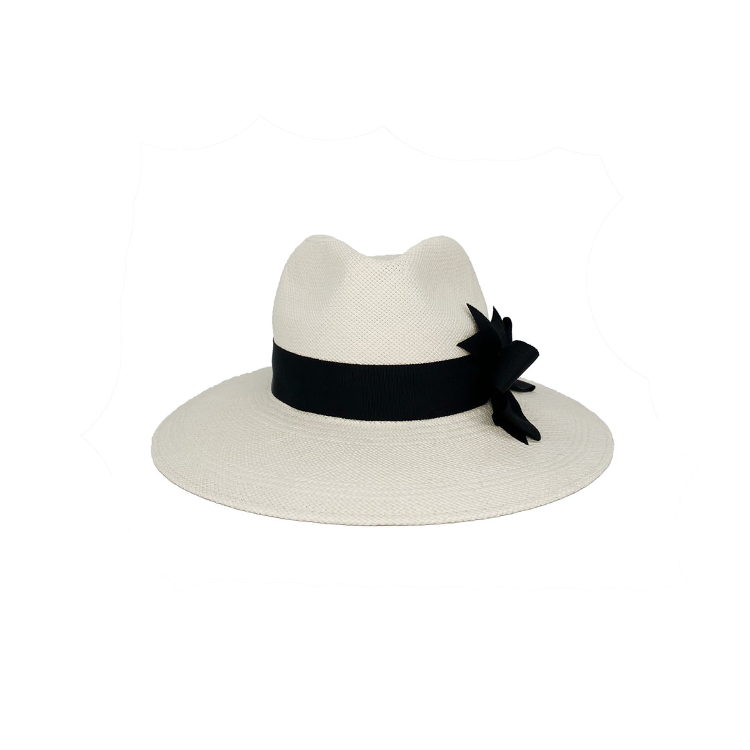 Photo of a bleached white panama fedora with a black grosgrain bow