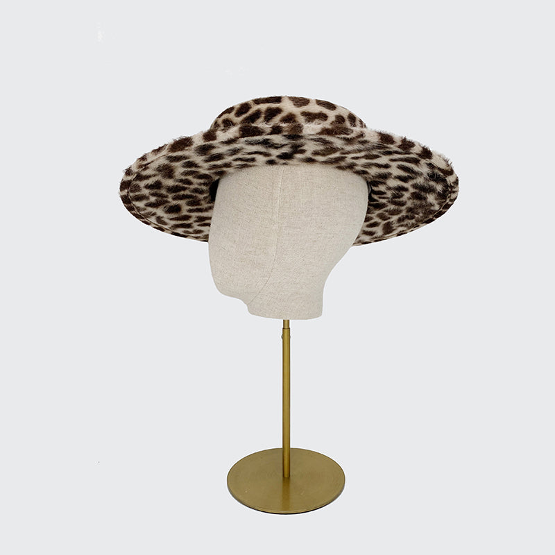 Side view of an animal print felt boater with a grosgrain band